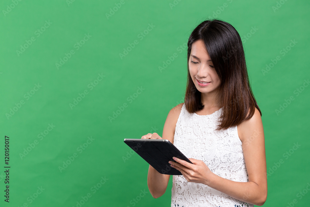 Woman working on digital tablet Woman working on digital tablet