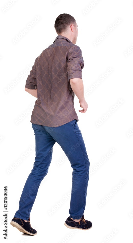Back view of running man in brown shirt. Walking guy in motion. Rear view people collection. Backside view of person. Isolated over white background. Back view of running man in brown shirt. Walking guy in motion. Rear view people collection. Backside view of person. Isolated over white background.