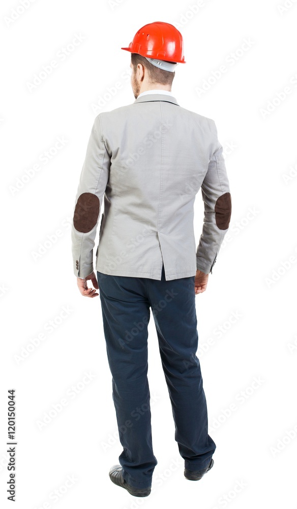 Backview of an engineer in construction helmet stands. Standing young guy. Rear view people collection. backside view of person. Isolated over white background. Businessman in a suit on a Backview of an engineer in construction helmet stands. Standing young guy. Rear view people collection. backside view of person. Isolated over white background. Businessman in a suit on a