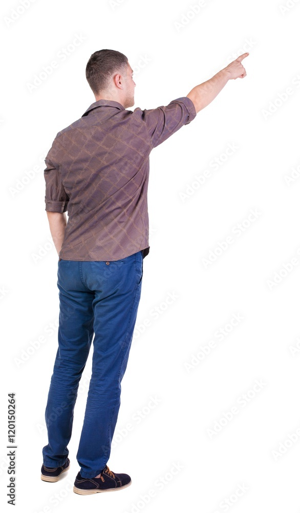 Back view of pointing young men in shirt and jeans. Young guy gesture. Rear view people collection. backside view of person. Isolated over white background.
Back view of pointing young men in shirt and jeans. Young guy gesture. Rear view people collection. backside view of person. Isolated over white background.