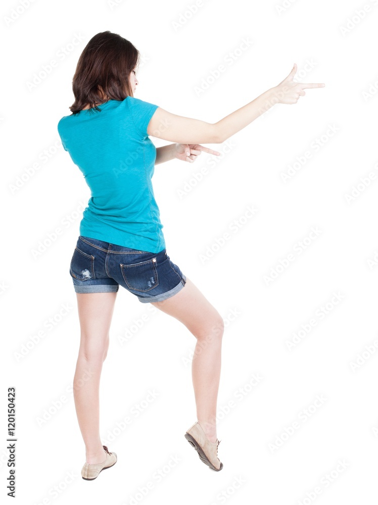Back view of pointing woman. beautiful brunette girl in shorts. Rear view people collection. backside view of person. Isolated over white background. Back view of pointing woman. beautiful brunette girl in shorts. Rear view people collection. backside view of person. Isolated over white background.