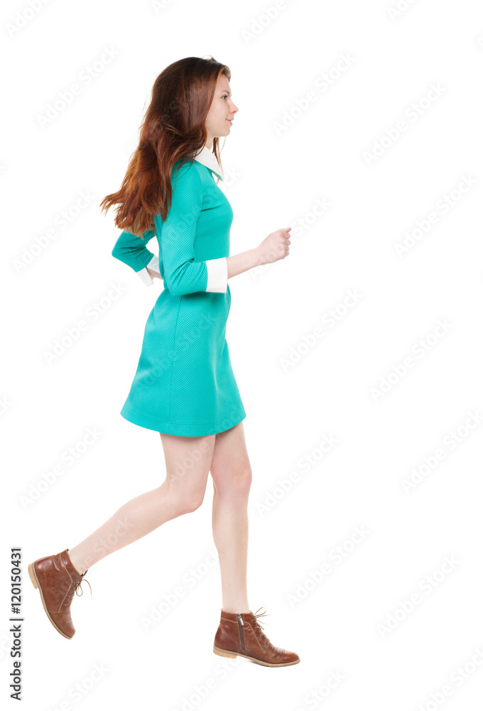 back view of running woman. beautiful girl in motion. backside view of person. Rear view people collection. Isolated over white background. smiling girl runs right back view of running woman. beautiful girl in motion. backside view of person. Rear view people collection. Isolated over white background. smiling girl runs right