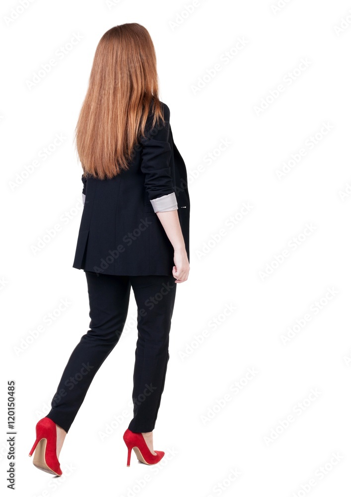walking red head business woman. back view. going young girl in suit. Rear view people collection. back side view of person. Isolated over white background. walking red head business woman. back view. going young girl in suit. Rear view people collection. back side view of person. Isolated over white background.
