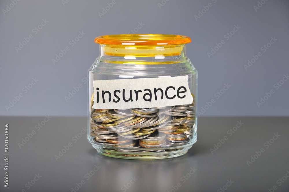 Saving concept of coins in the glass jar for insurance purpose Saving concept of coins in the glass jar for insurance purpose