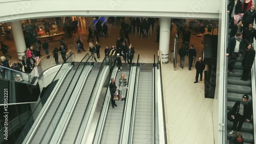 Timelapse people flow on escalators