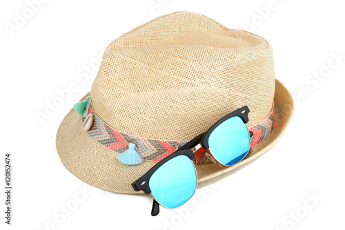 Beach hat with sunglasses isolated on white background.