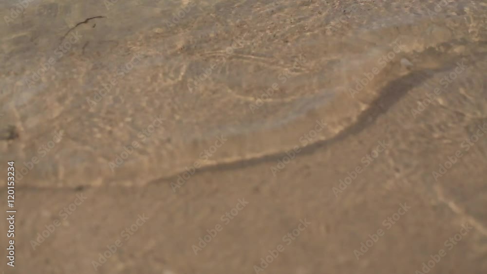 Woman feet closeup of girl relaxing on beach Woman feet closeup of girl relaxing on beach