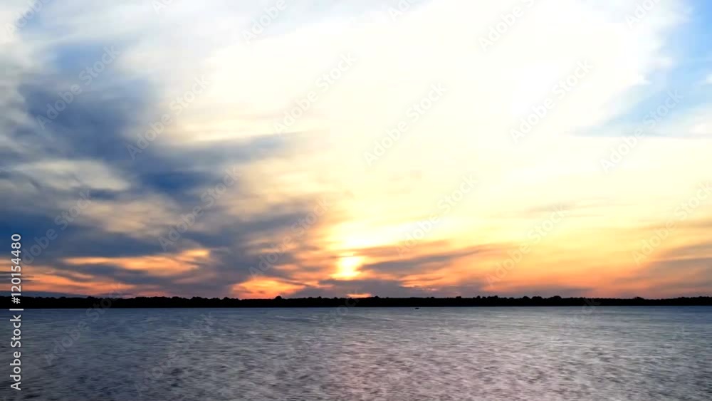 Sunrise time lapse over water with colorful clouds Sunrise time lapse over water with colorful clouds
