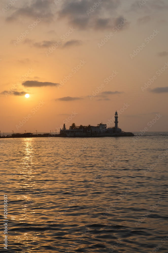 Mosque Haji Ali in Mumbai at sunset; Mosque was built in 1431 in memory of a rich Muslim merchant 