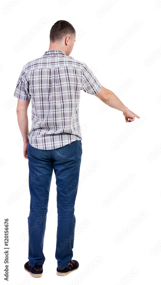 Back view of pointing young men in shirt and jeans. Young guy gesture. Rear view people collection. backside view of person. Isolated over white background.
Back view of pointing young men in shirt and jeans. Young guy gesture. Rear view people collection. backside view of person. Isolated over white background.