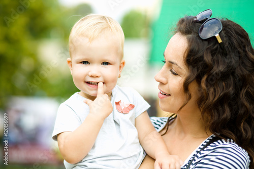 Mother holds child