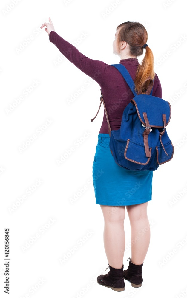 Back view of pointing woman with backpack looking up. Standing young girl. Rear view people collection. backside view of person. Isolated over white background. The girl with big blue backpack shows Back view of pointing woman with backpack looking up. Standing young girl. Rear view people collection. backside view of person. Isolated over white background. The girl with big blue backpack shows