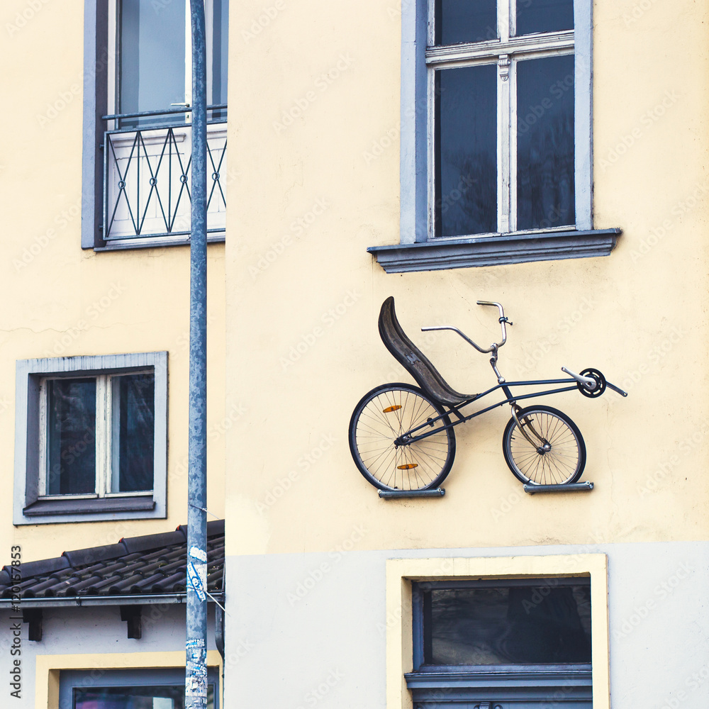 Bike on facade of building as a decoration Bike on facade of building as a decoration