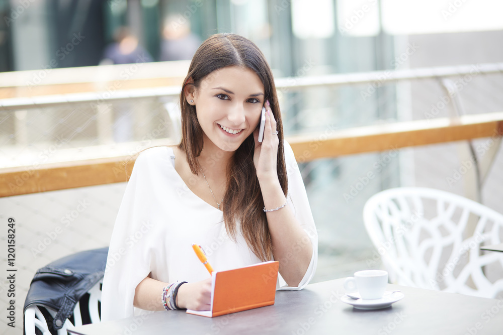 Fototapeta premium young businesswoman talking to mobile