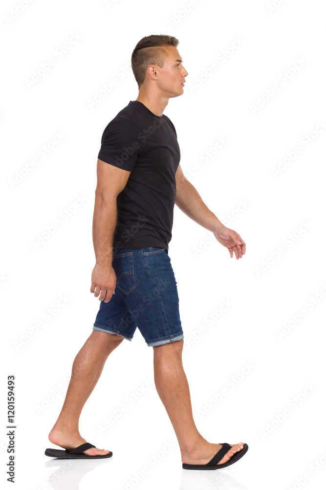 Man Walking In Flip-Flops. Side View Man Walking In Flip-Flops. Side View