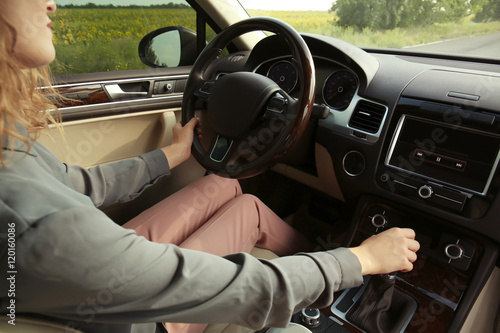 Young woman driving car