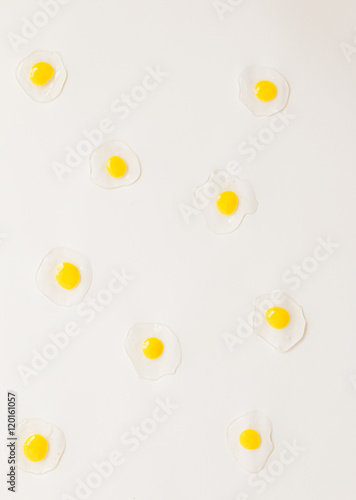 Egg yolk  pattern on soft pauple background. Top view.