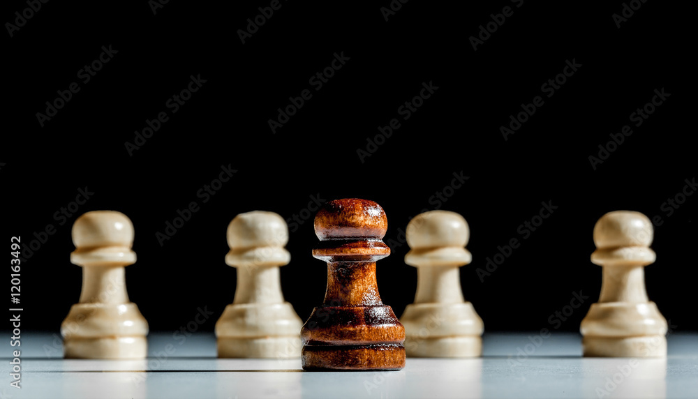 chess pieces on a black background chess pieces on a black background