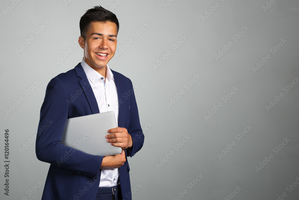 Portrait of smiling young man with laptop Portrait of smiling young man with laptop
