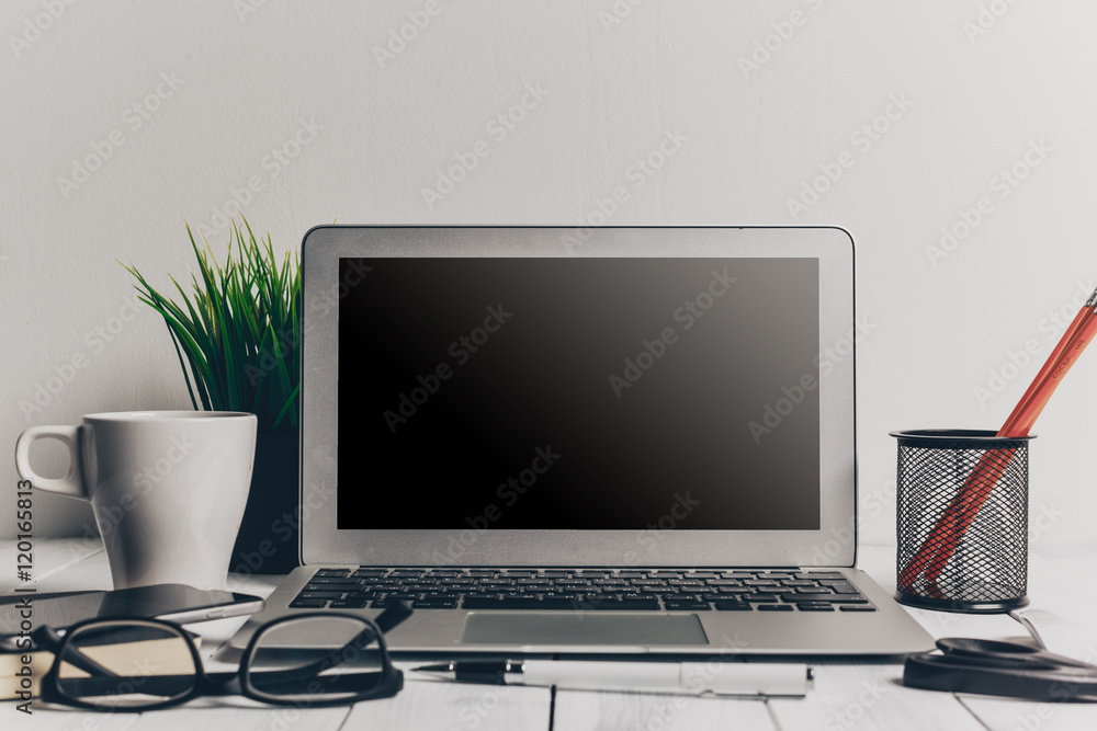 Fototapeta premium Laptop and other electronics on workspace