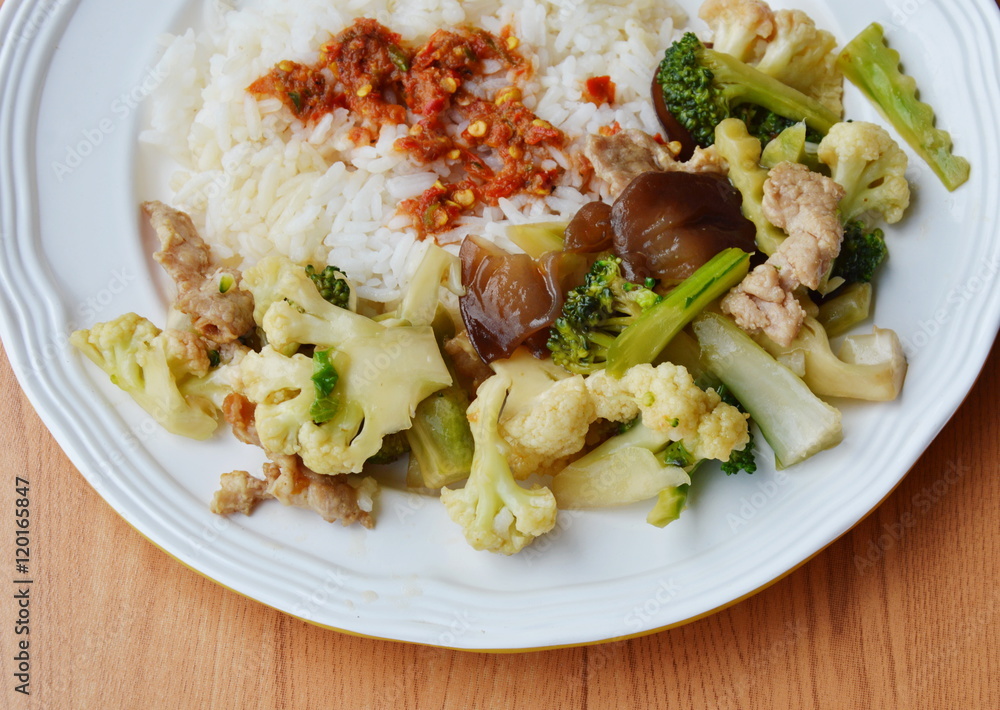 stir fried mixed vegetable with pork and spicy shrimp paste on rice stir fried mixed vegetable with pork and spicy shrimp paste on rice
