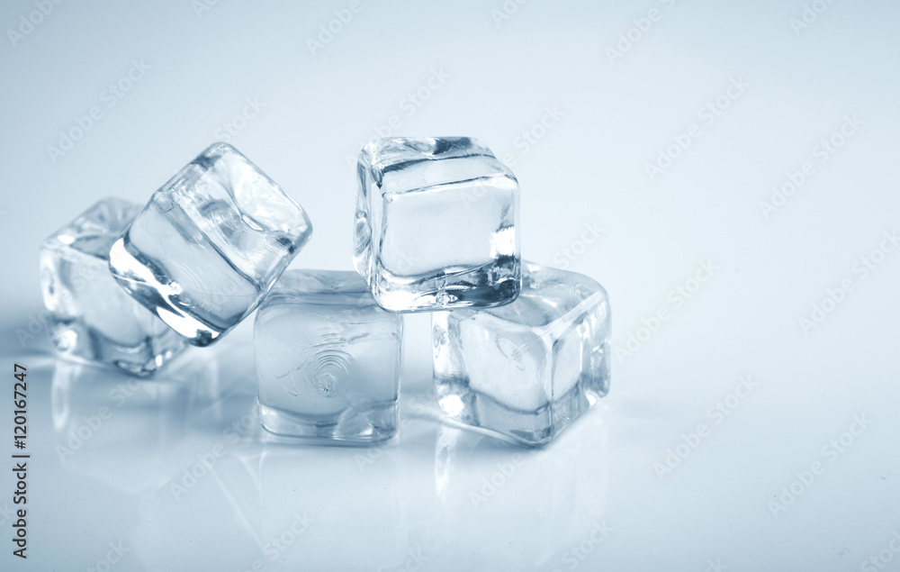 Five ice cubes blue toning photo studio shot Five ice cubes blue toning photo studio shot