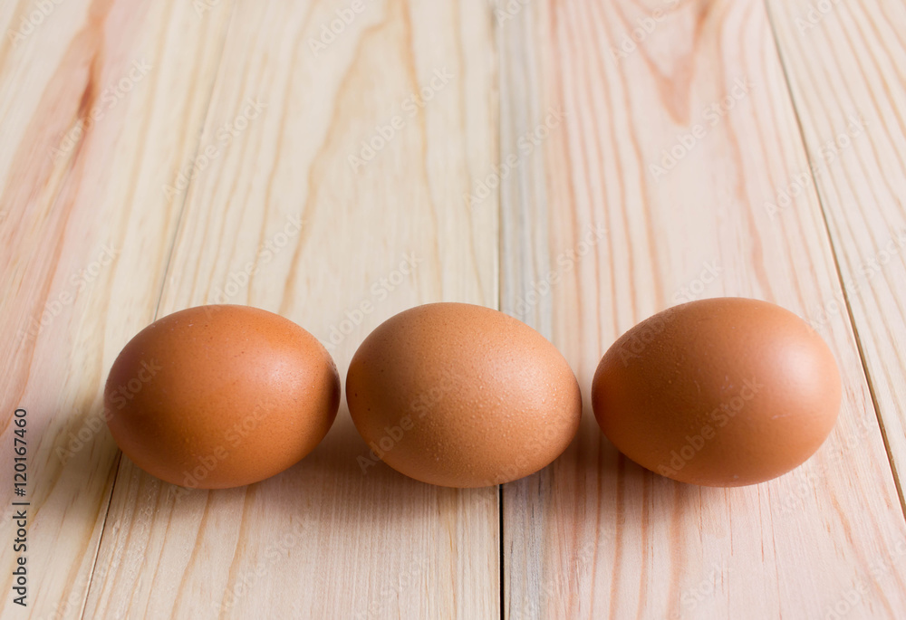 Eggs on the wooden background, cooking concept Eggs on the wooden background, cooking concept