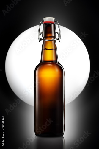Swing top bottle of light beer isolated on black background