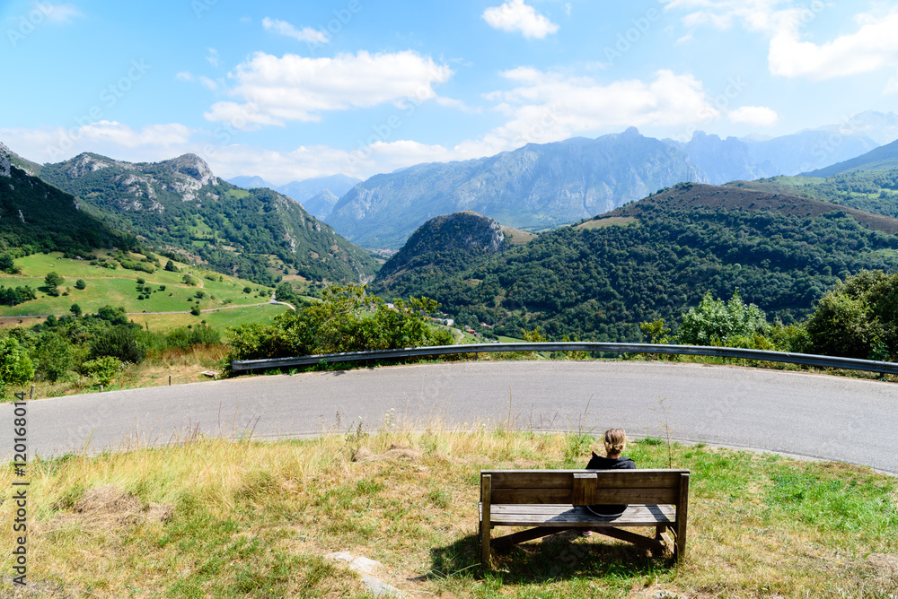 Woman watching mountains of Asturias Woman watching mountains of Asturias