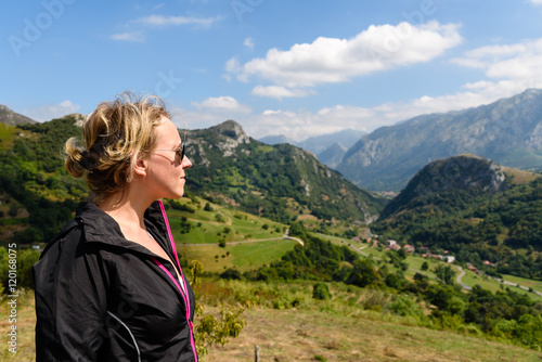 Woman watching mountains of Asturias
