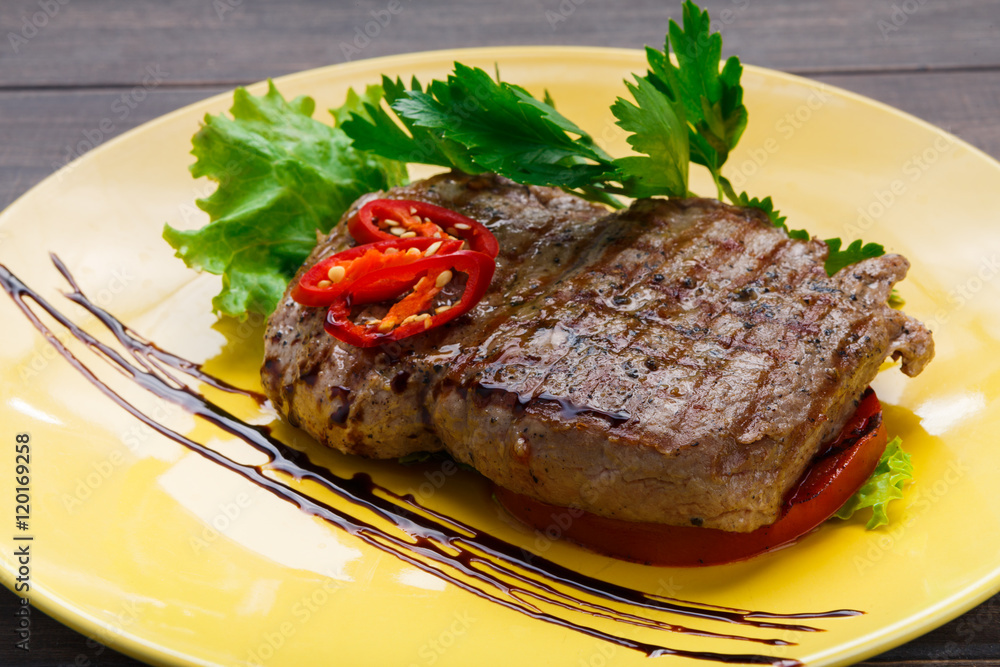 Restaurant food on wooden table. Perfect beef steak Restaurant food on wooden table. Perfect beef steak
