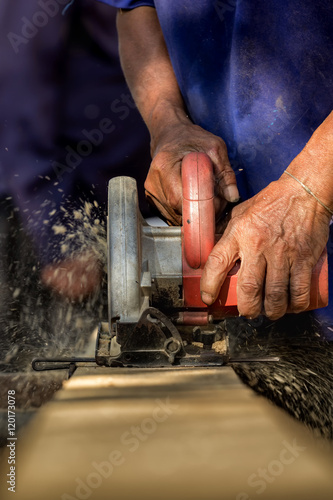 Close-up of carpenter's hands working with wood