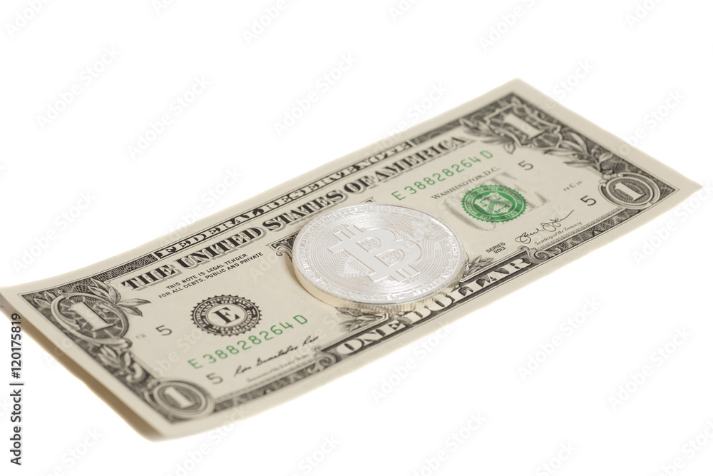 Silver bitcoin coin and one dollar banknote Silver bitcoin coin and one dollar banknote