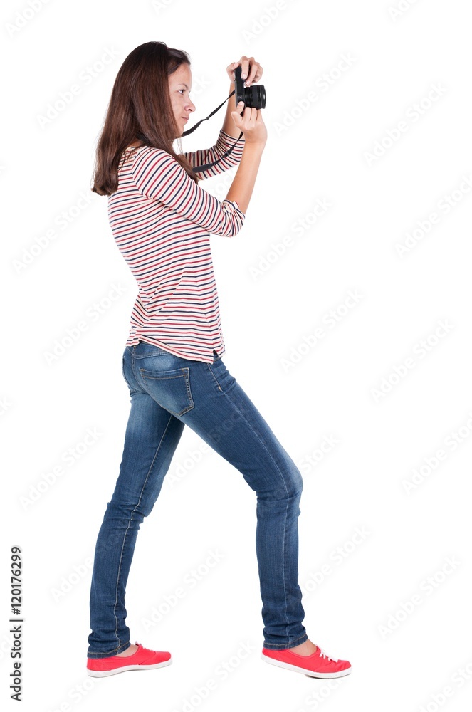 Back view of woman photographing. girl photographer in jeans. Rear view people collection. backside view of person. Isolated over white background. Back view of woman photographing. girl photographer in jeans. Rear view people collection. backside view of person. Isolated over white background.