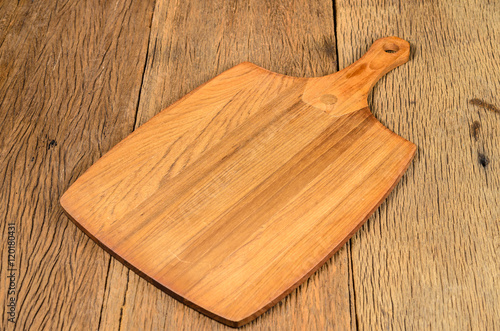 wooden chopping board on wooden table