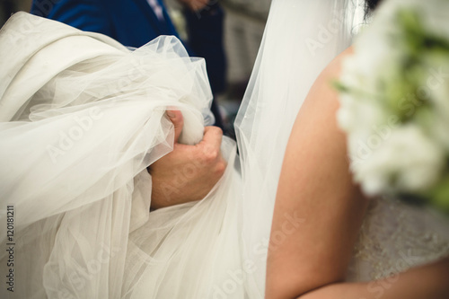 bride holding her white dress