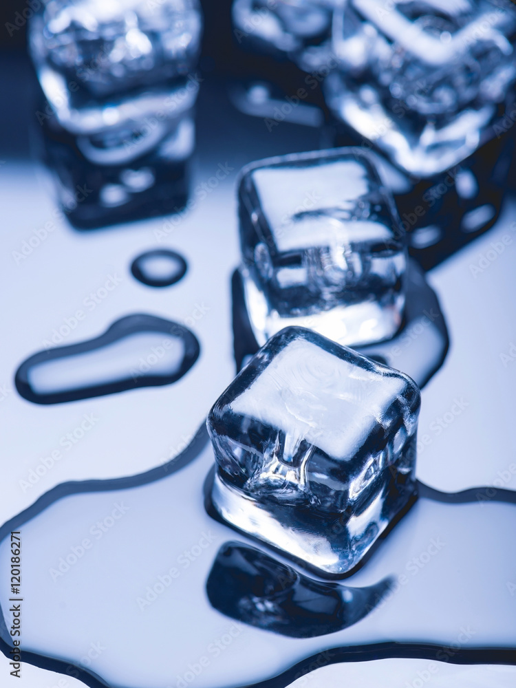 Melted pieces of ice on a dark background Melted pieces of ice on a dark background
