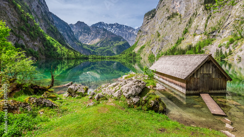Little hut at the Obersee lake in German Alps