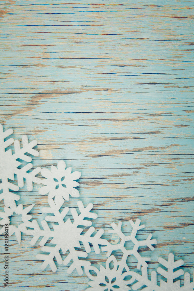Fototapeta premium A christmas decoration on a turquoise vintage background