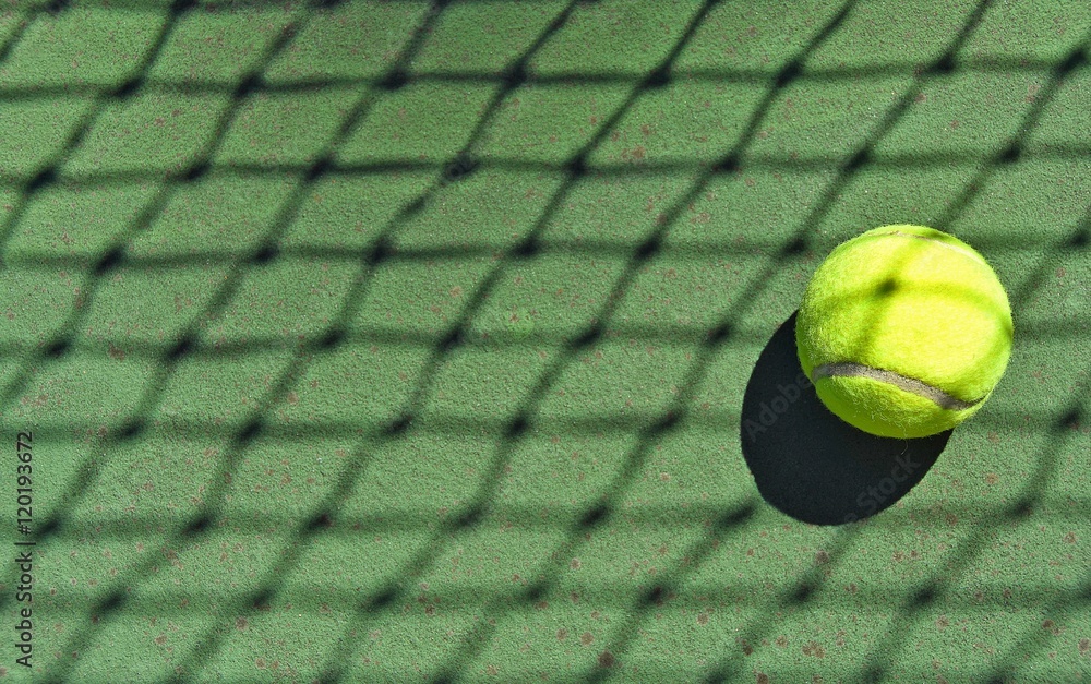 tennis ball in net shadow