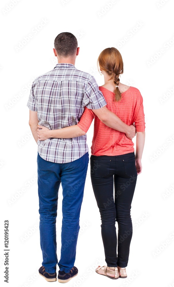 Back view of young embracing couple (man and woman) hug and look into the distance. beautiful friendly girl and guy together. Rear view people collection. backside view of person. Isolated over Back view of young embracing couple (man and woman) hug and look into the distance. beautiful friendly girl and guy together. Rear view people collection. backside view of person. Isolated over