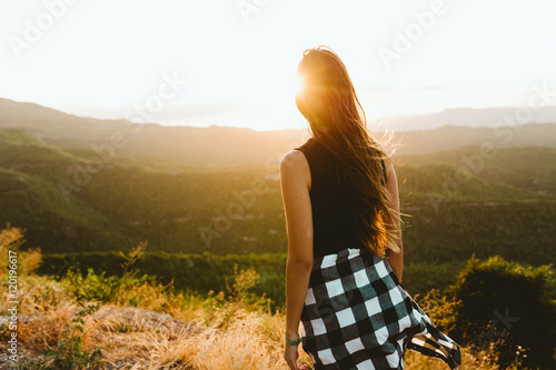 Wallpaper Mural Beautiful young woman enjoying nature at mountain peak. Torontodigital.ca