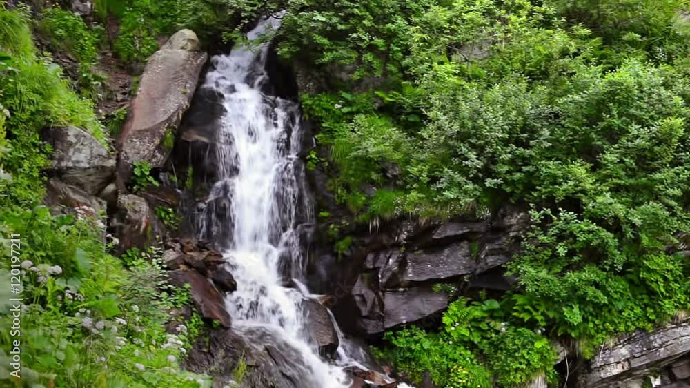 Mountain stream with a waterfall in the fairy forest of the Carpathians Mountain stream with a waterfall in the fairy forest of the Carpathians