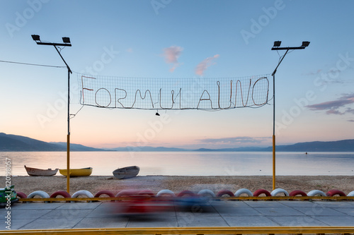 Electric karts for children at sunset by the Lake Ohrid, Albania photo