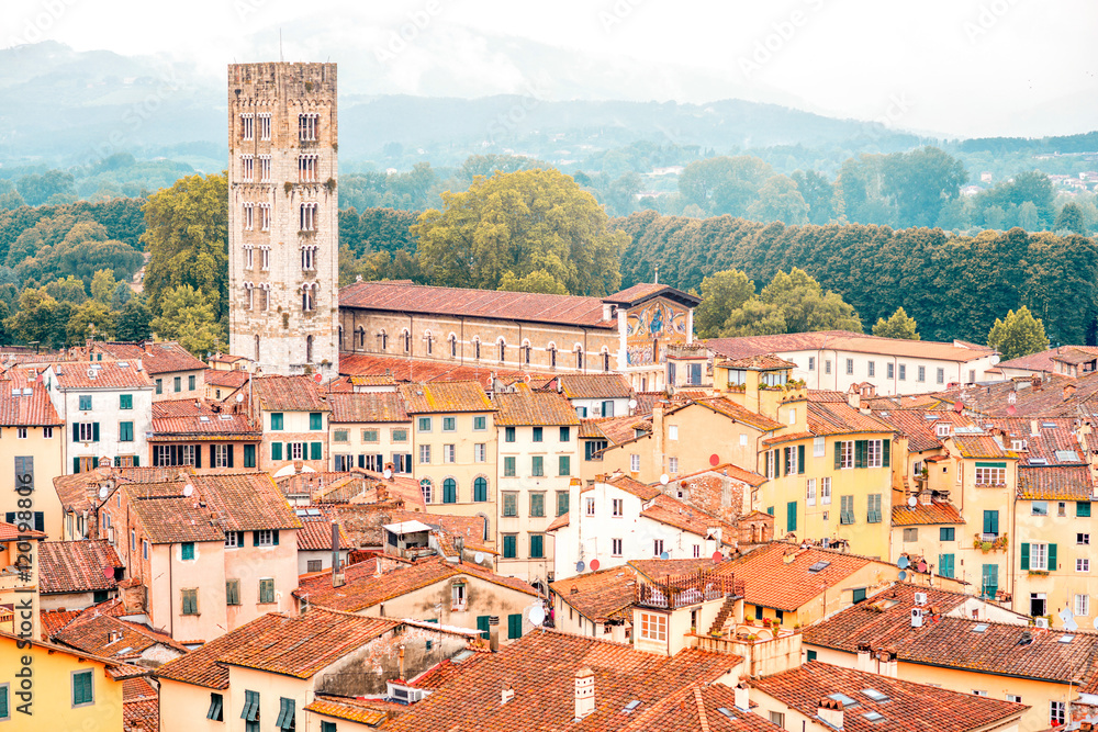 Aerial cityscape view on the old town of Lucca with San Frediano basilica tower in Italy