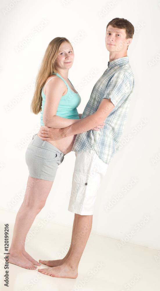young couple embrace pregnant woman, Dutch angle young couple embrace pregnant woman, Dutch angle