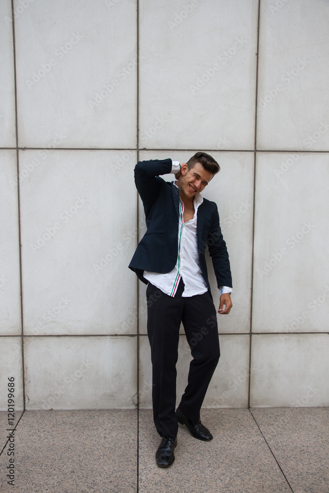 Handsome, white and strong business man posing in photos of business and fashion theme on the street. Handsome, white and strong business man posing in photos of business and fashion theme on the street.