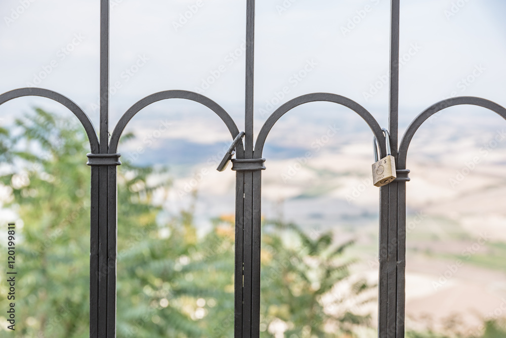 The padlock of love in the city of Montalcino, Tuscany - Italy The padlock of love in the city of Montalcino, Tuscany - Italy