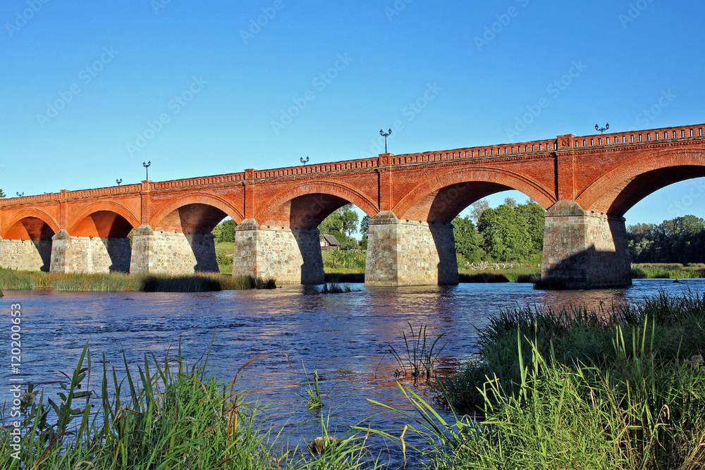 Brick bridge across river Venta in Kuldiga, Latvia