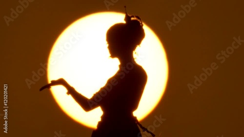 Silhouette girl oriental dancer a dance on sunset